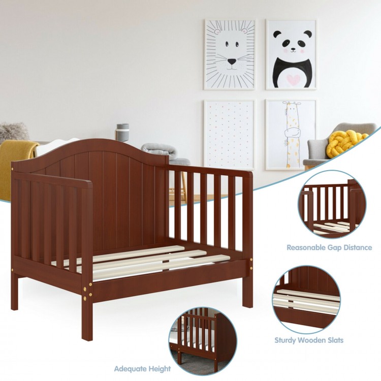 Classic brown wooden toddler bed with guardrails, sturdy slats, and convertible design for safety and independence.