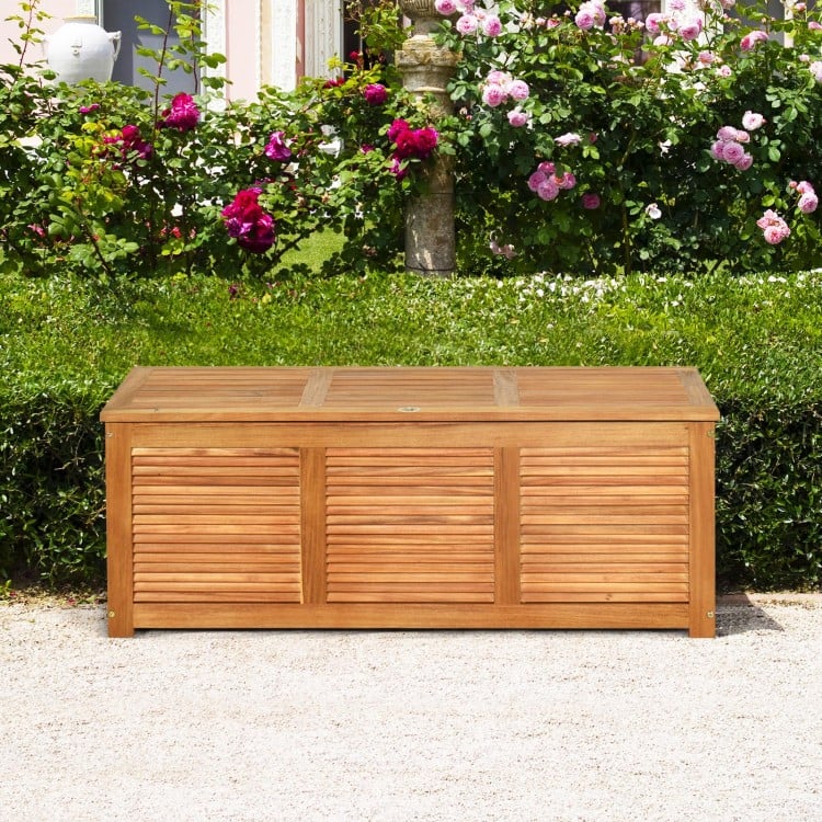 Acacia wood storage bench box with flip-top lid, perfect for patio or garden, offering 46-gallon capacity.