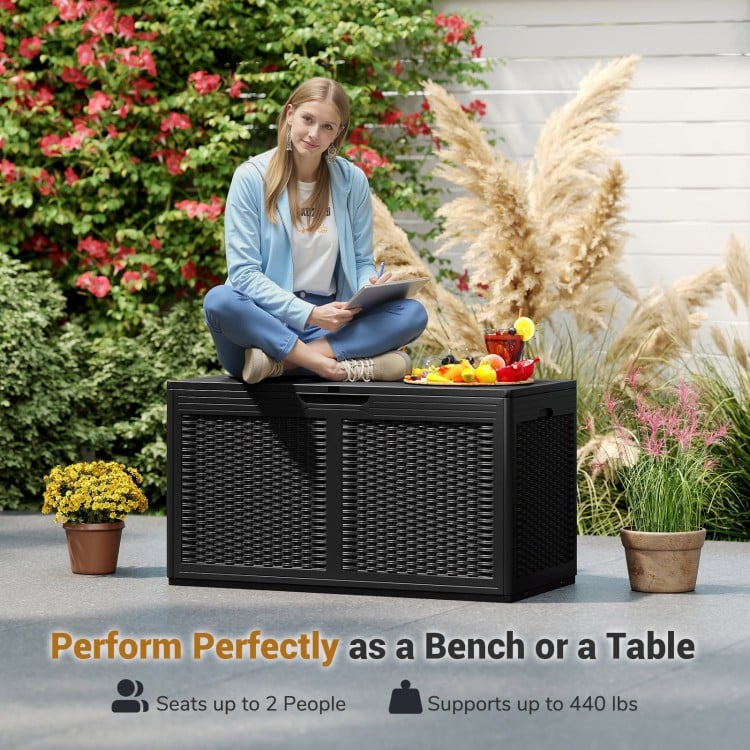Black 100-gallon resin deck box with rattan texture, serving as a bench or table, supports up to 440 lbs for outdoor.
