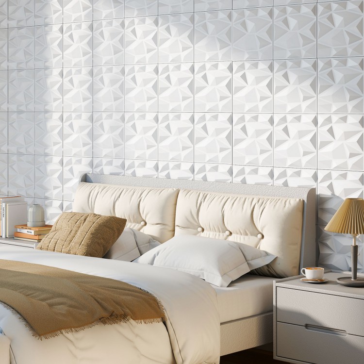 3D white PVC wall panels with diamond accents, perfect for DIY interior decoration in bedrooms or living spaces.