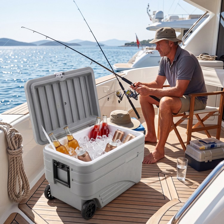 Gray 103 Quart outdoor portable wheeled ice cooler with foldable handles, ideal for keeping drinks cold on a boat.