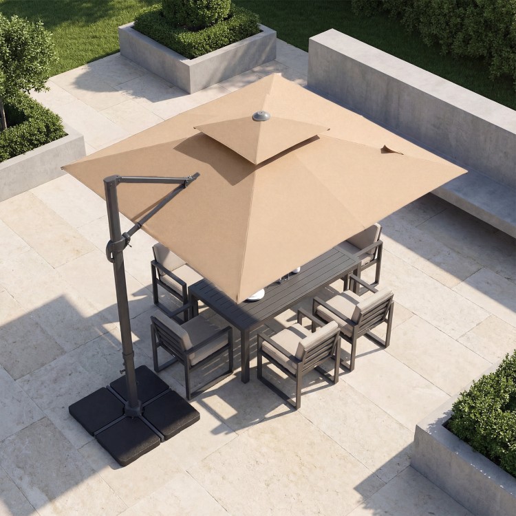Brown 10 FT aluminum pole cantilever umbrella with 220 lbs base, providing shade for outdoor dining set.