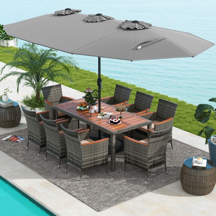 10-piece patio wicker dining set with gray cushions and a large double-sided umbrella, perfect for outdoor gatherings.