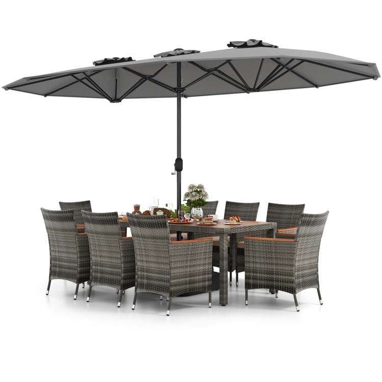 10-piece gray patio wicker dining set with acacia wood tabletop and large double-sided umbrella for outdoor gatherings.