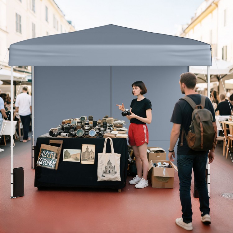 Gray 10 x 10 ft pop-up canopy tent with sidewalls, ideal for outdoor markets and events, providing sun protection.