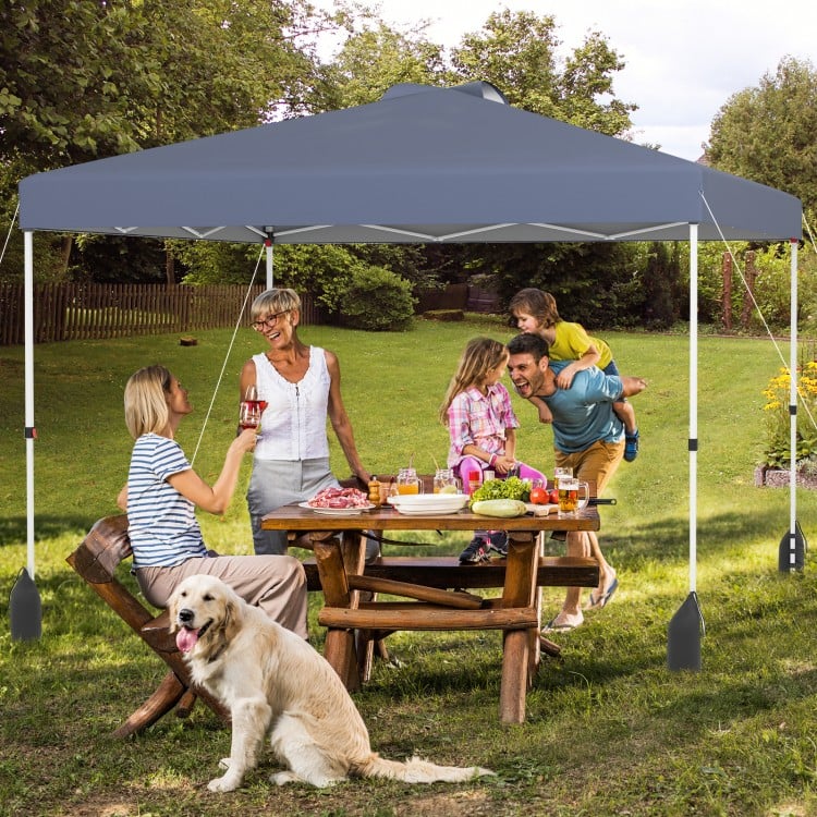 Gray 10 x 10 ft pop-up canopy tent with sidewall, set up for outdoor gathering, providing sun protection and shade.