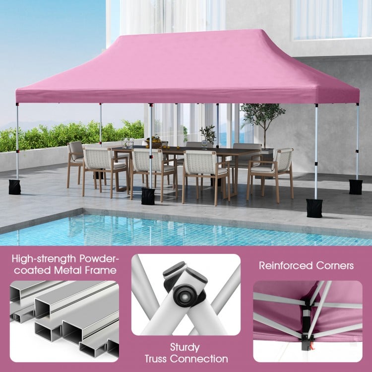 Pink 10 x 20 ft pop-up canopy tent with a sturdy metal frame, ideal for outdoor events and gatherings.
