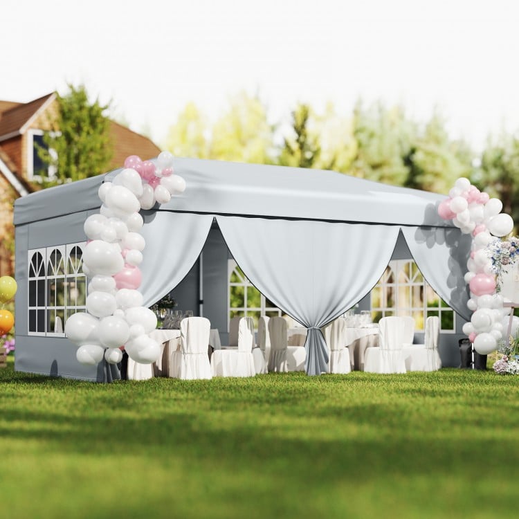 Gray 10 x 20 feet pop-up canopy tent with 6 sidewalls, ideal for outdoor events and gatherings.
