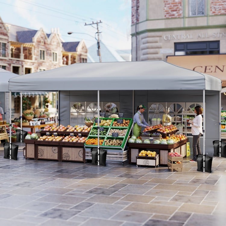 Pop-up canopy tent with gray Oxford cloth, featuring 6 sidewalls, ideal for outdoor markets and events.