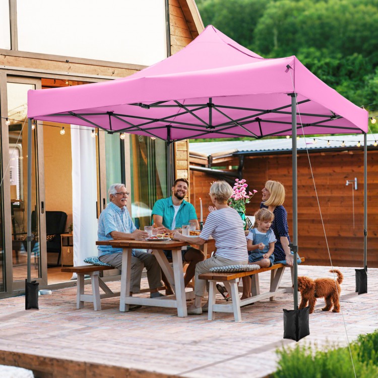 Pink 10 x 10 FT outdoor pop-up canopy tent set up for a gathering, featuring a sturdy metal frame and water-resistant.