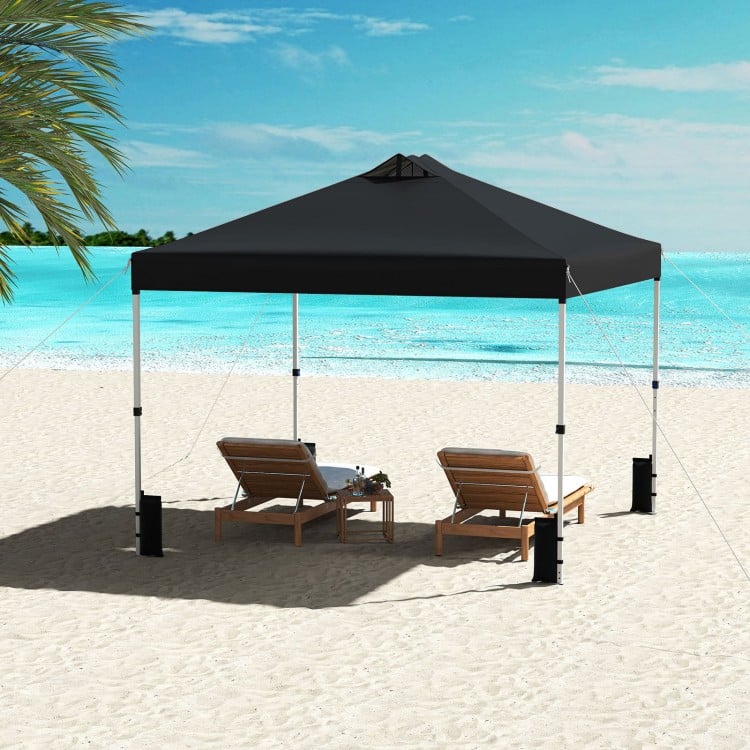 Black 10 x 10 feet outdoor pop-up canopy tent with sturdy steel frame, ideal for beach relaxation and outdoor.