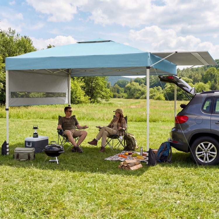 10x17 feet blue pop-up canopy tent with dual adjustable awnings, providing shade for outdoor gatherings and activities.