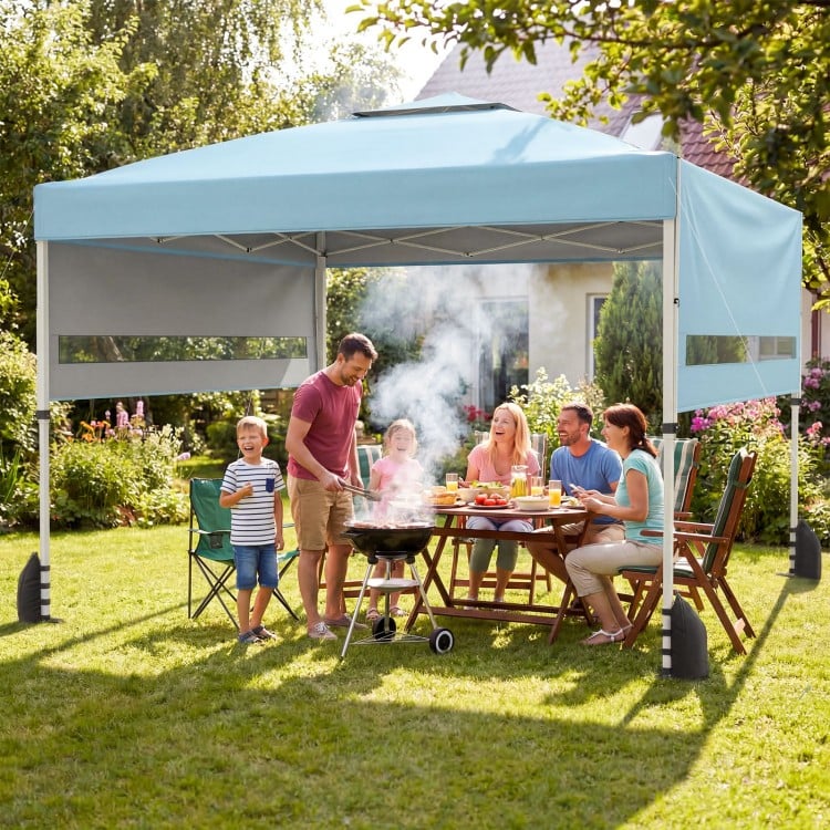 Pop up canopy tent with blue oxford canopy and adjustable awnings, perfect for outdoor gatherings and BBQs.