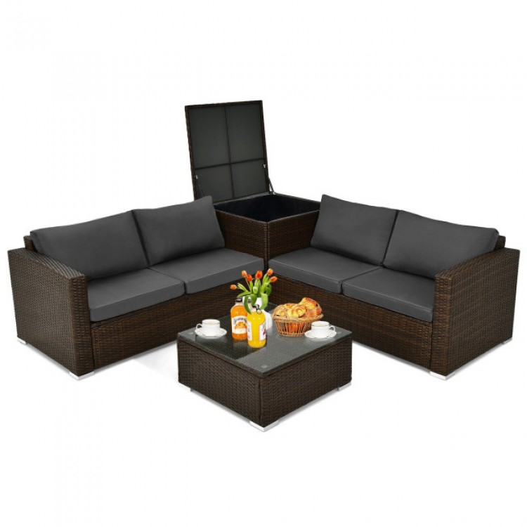 4-piece patio rattan furniture set with gray cushions, storage box, and tempered glass tabletop for outdoor relaxation.