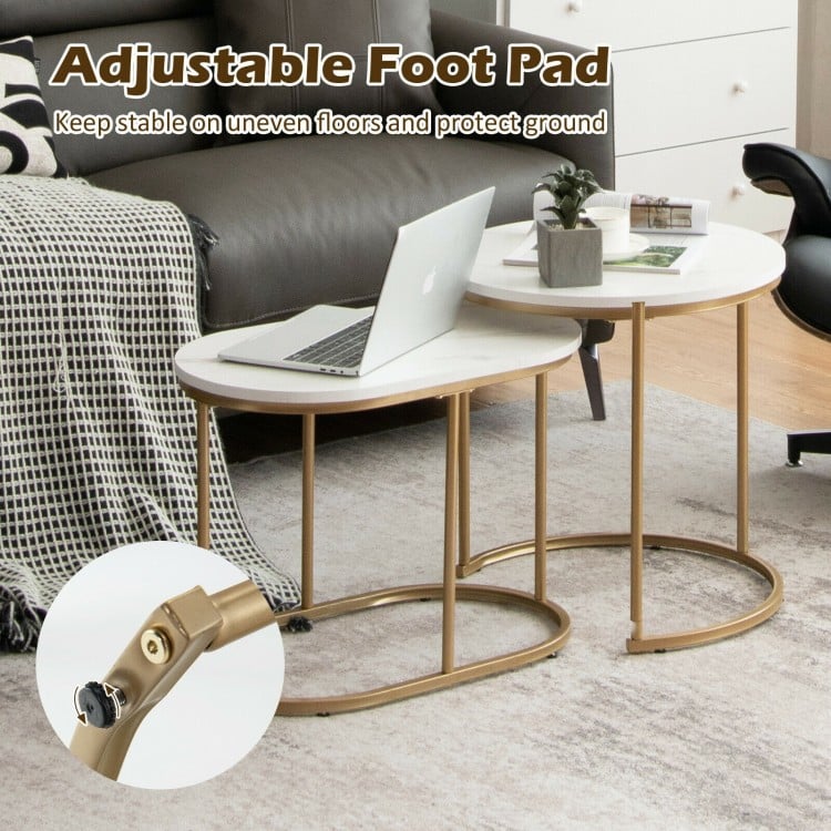 Adjustable foot pad detail of modern nesting coffee table set with white MDF tops and gold steel frames, ensuring.