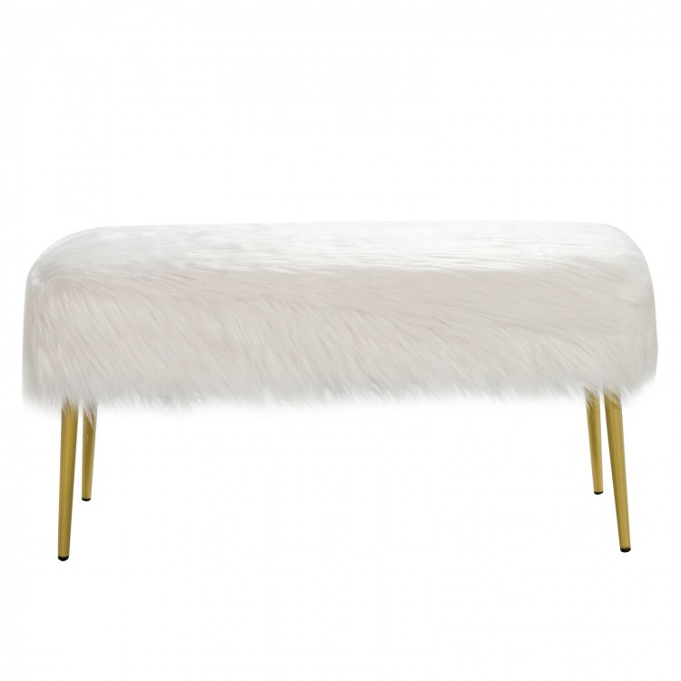 Upholstered faux fur vanity stool with golden legs, offering comfort and style for makeup rooms or extra seating.