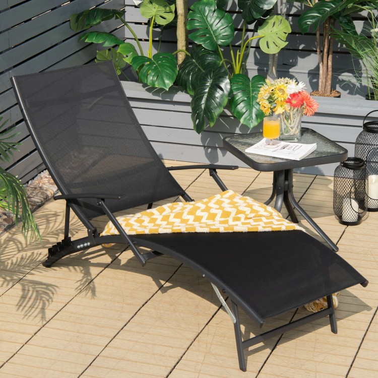 Black folding patio lounge chair with armrest, featuring a 5-position adjustable backrest for outdoor relaxation.