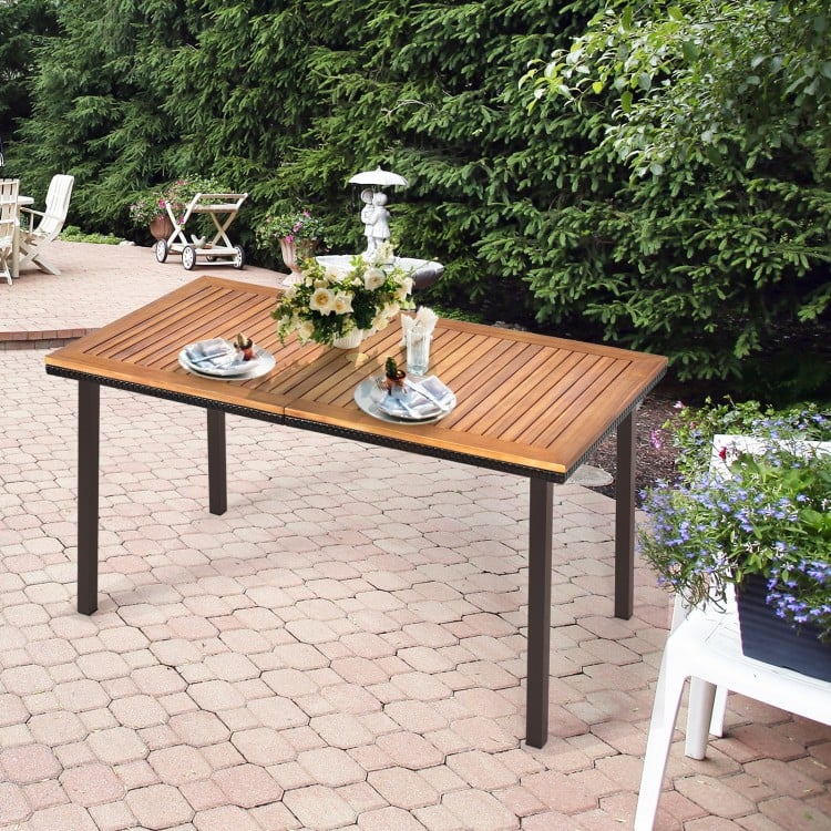 Acacia wood patio dining table with slatted surface, umbrella hole, perfect for outdoor gatherings in your backyard.