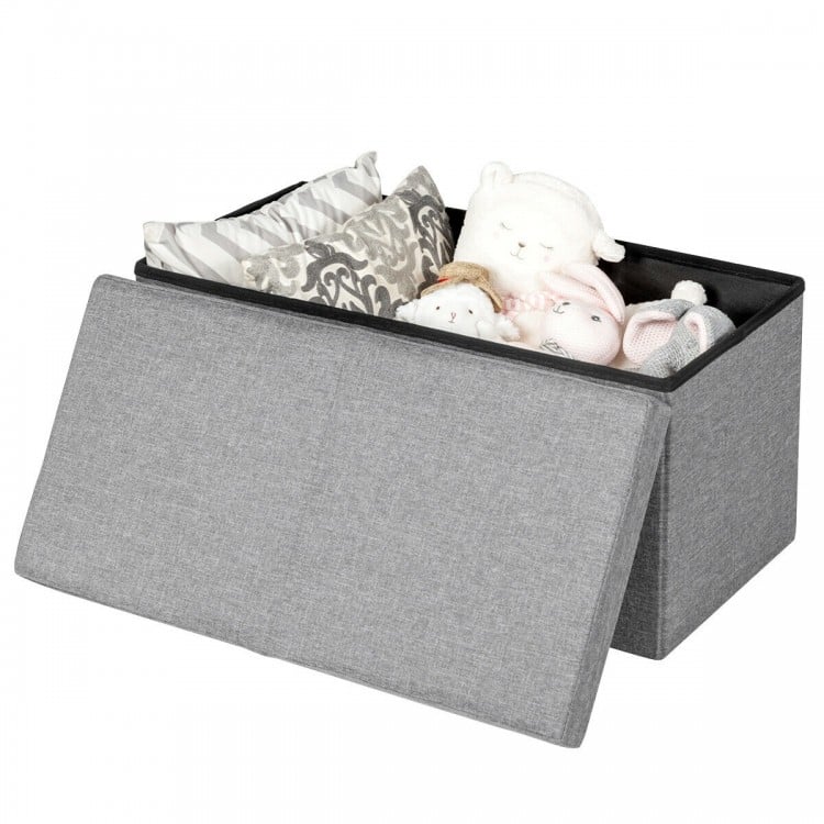 Light gray folding storage ottoman with lift top, featuring spacious interior for blankets and toys, made of sturdy MDF.