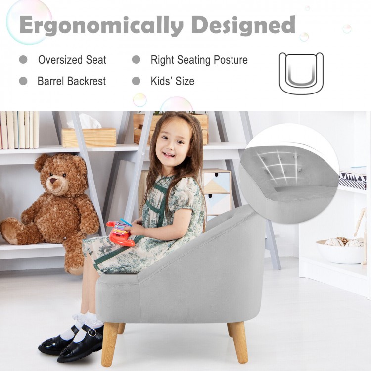 Kids' gray velvet upholstered sofa chair with barrel backrest and ottoman, designed for comfort and proper seating.