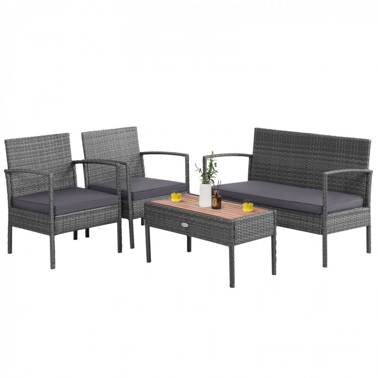 4-piece rattan patio conversation set with acacia wood tabletop, featuring 2 single sofas and a loveseat for outdoor.