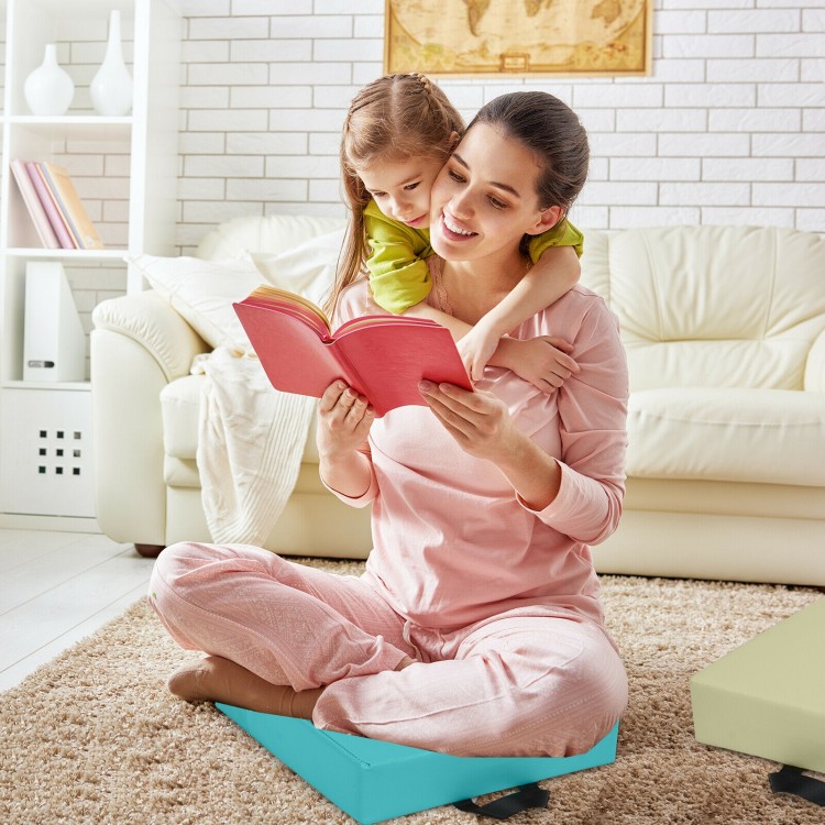 Soft blue toddler floor cushion with handles, 15 inches square, perfect for kids' seating in homes and daycares.