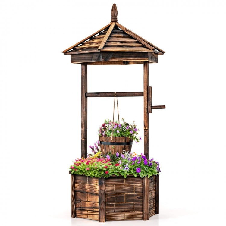 Rustic wooden wishing well planter with adjustable bucket, made from carbonized fir wood, perfect for garden or patio.