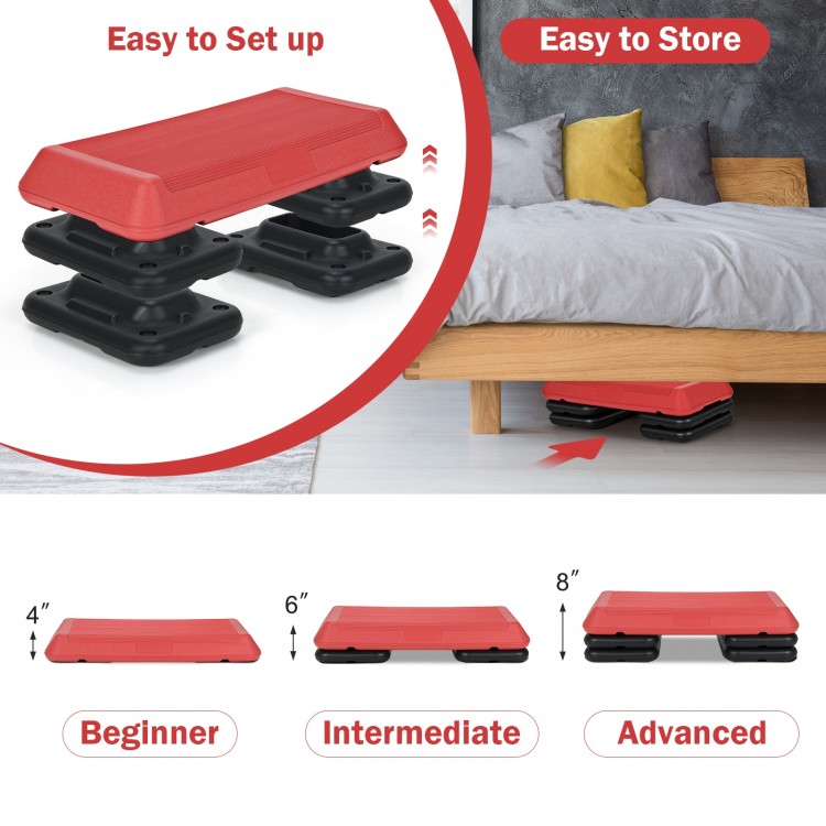 Adjustable red aerobic stepper platform with detachable risers for varied workout intensity, perfect for home or gym.