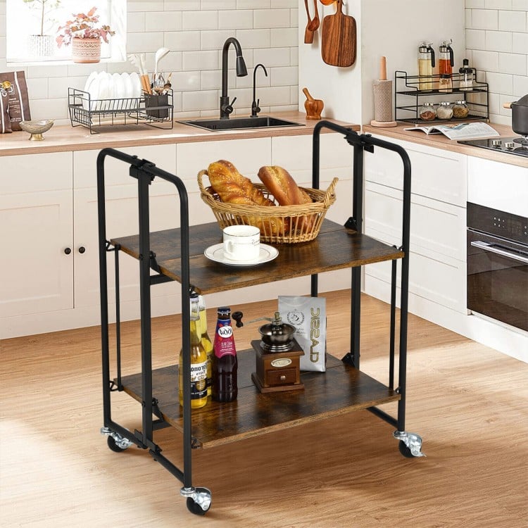 Folding rolling cart with metal frame and rustic wood finish, featuring two tiers for versatile storage in any room.