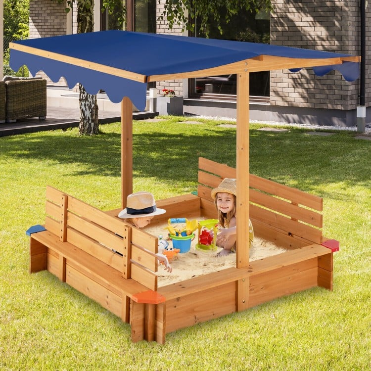 Kids wooden sandbox with canopy and two bench seats, made of cedar wood, perfect for outdoor play and relaxation.