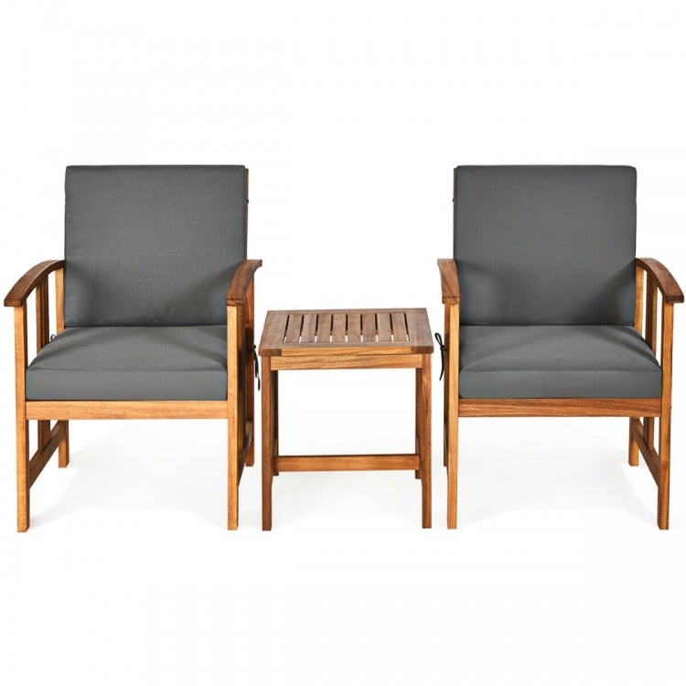 Two gray cushioned chairs with a solid acacia wood frame and a matching coffee table, ideal for outdoor patio use.