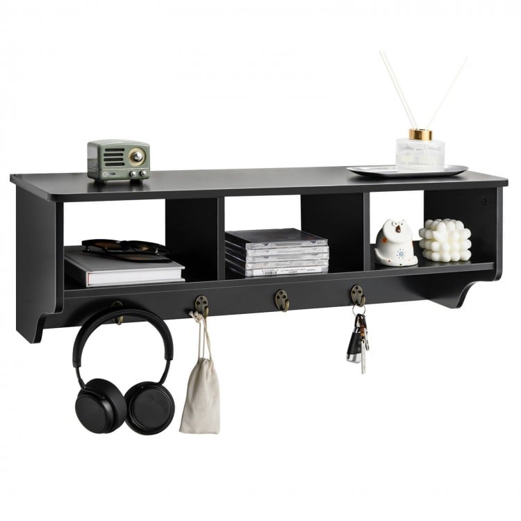Wall-mounted black cubby organizer shelf with four hooks, ideal for entryway storage and displaying decor items.
