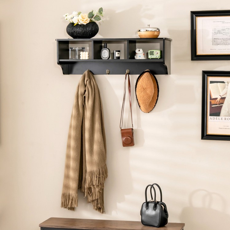 Wall-mounted black cubby organizer shelf with four hooks, perfect for entryway storage and displaying decor.
