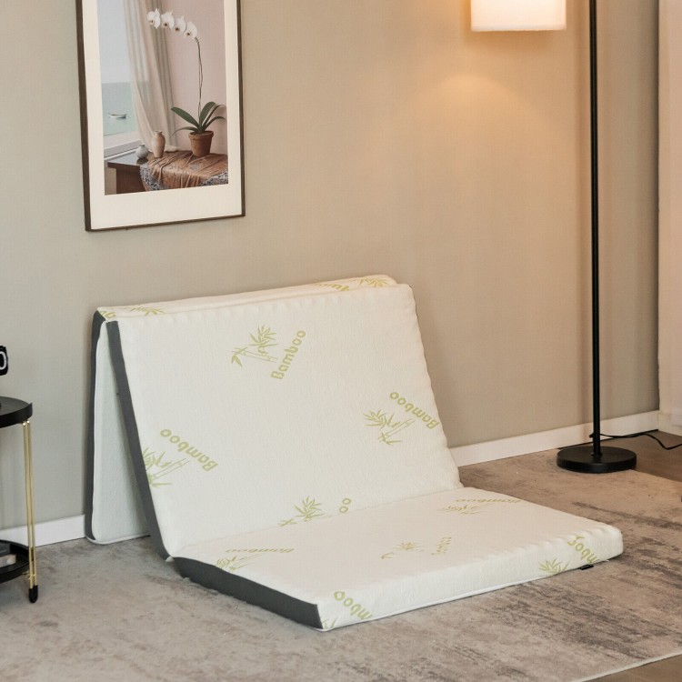 Tri-fold memory foam floor mattress with bamboo cover, ideal for portable lounging and easy storage with carrying bag.