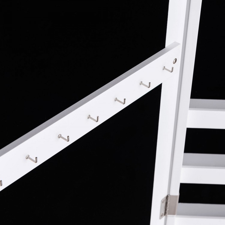Close-up of the wall-mounted jewelry armoire with hooks for necklaces and bracelets, featuring a sleek white design.