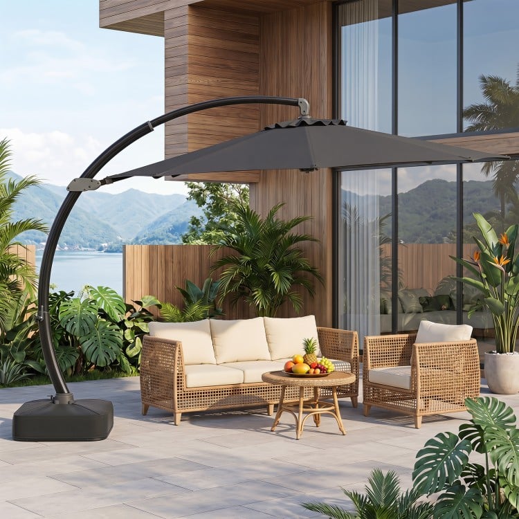 11 FT cantilever patio umbrella in gray with 360° rotation and tilt adjustment, perfect for outdoor shade.