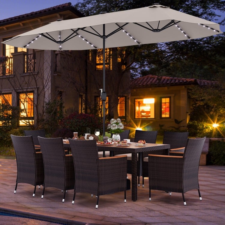 11-piece patio dining set featuring a 15-foot double-sided umbrella, hand-woven PE rattan chairs, and acacia wood table.