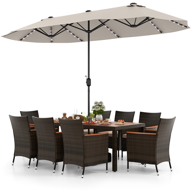 11-piece patio dining set featuring a 15 ft double-sided umbrella, hand-woven PE rattan, and acacia wood table for.