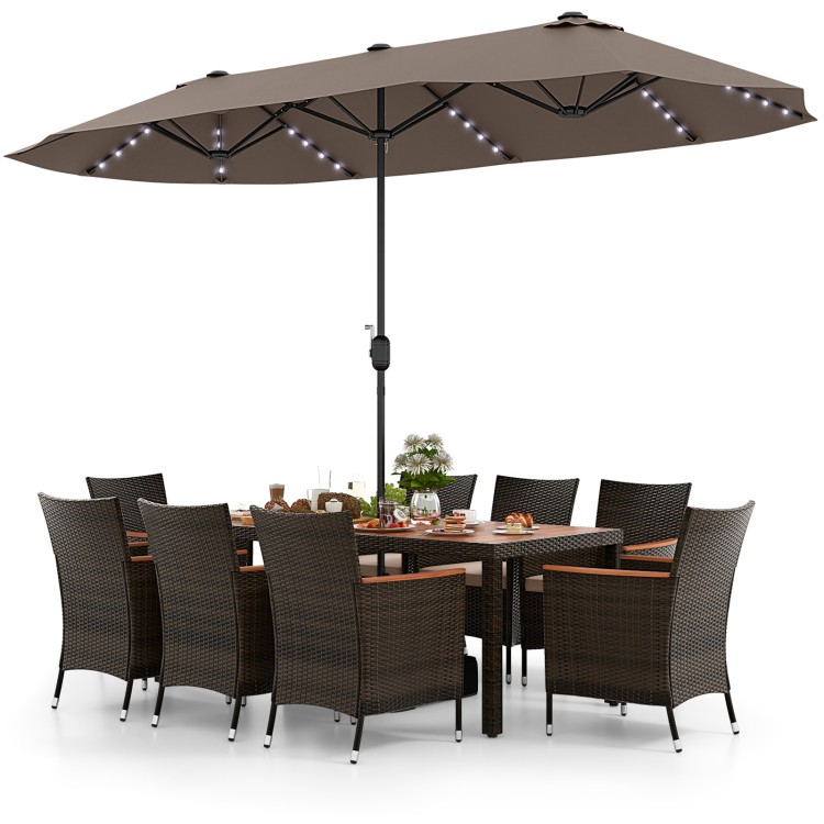 11-piece patio dining set featuring a 15 ft double-sided umbrella, hand-woven PE rattan, and acacia wood table for.