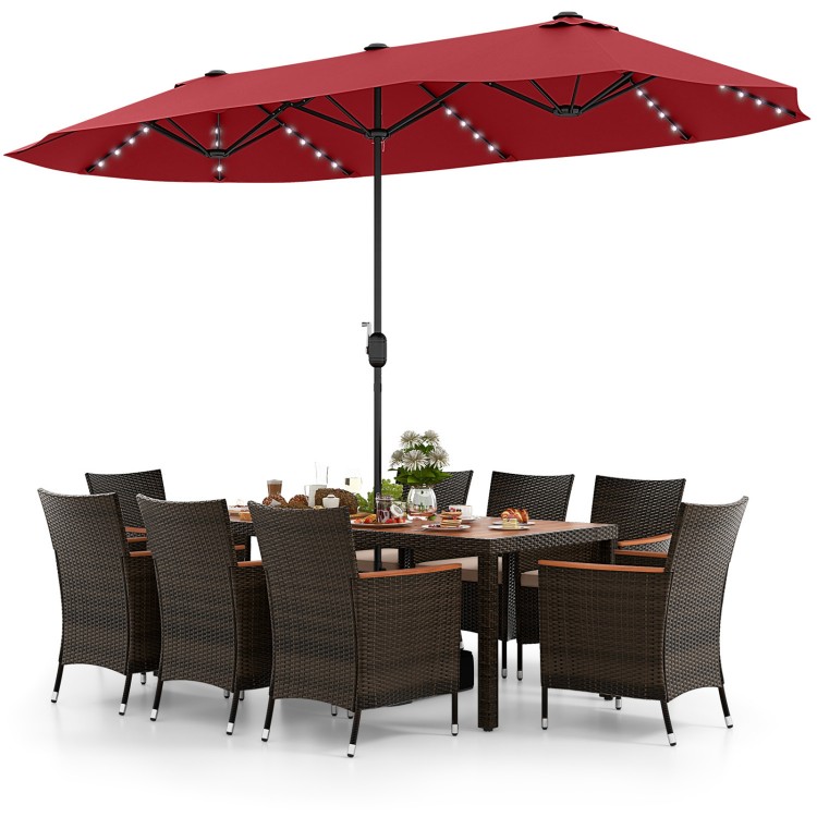 Patio dining set featuring 11 pieces with a 15 ft double-sided umbrella, crafted from PE rattan and acacia wood for.