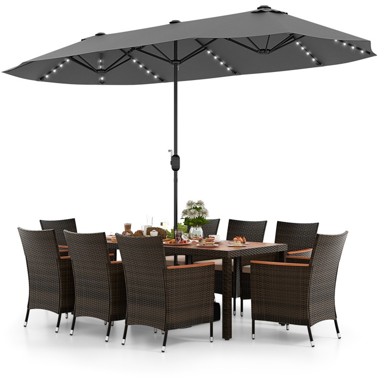 Patio dining set featuring 11 pieces with a 15 ft double-sided umbrella, crafted from PE rattan and acacia wood for.