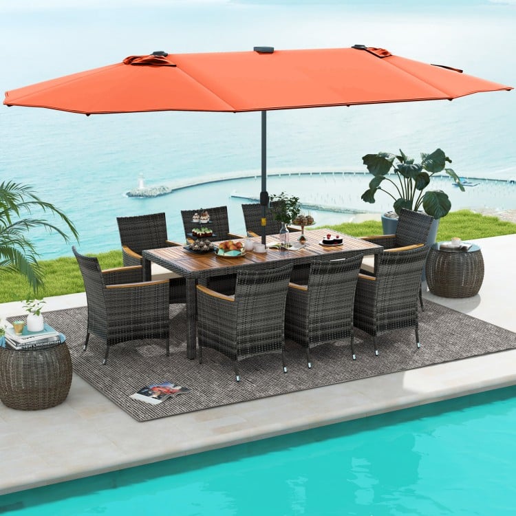 Patio dining set featuring 11 pieces with gray PE rattan, acacia wood table, and a 15 ft orange double-sided umbrella.