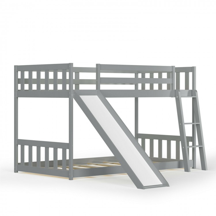 Twin over twin gray wooden bunk bed with slide and ladder, designed for kids' safety and fun in small spaces.