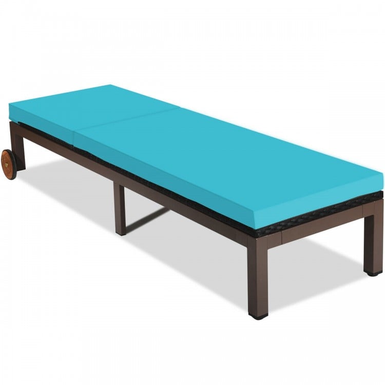Turquoise outdoor rattan chaise lounge with soft cushion and sturdy metal frame, perfect for lounging on balconies or.
