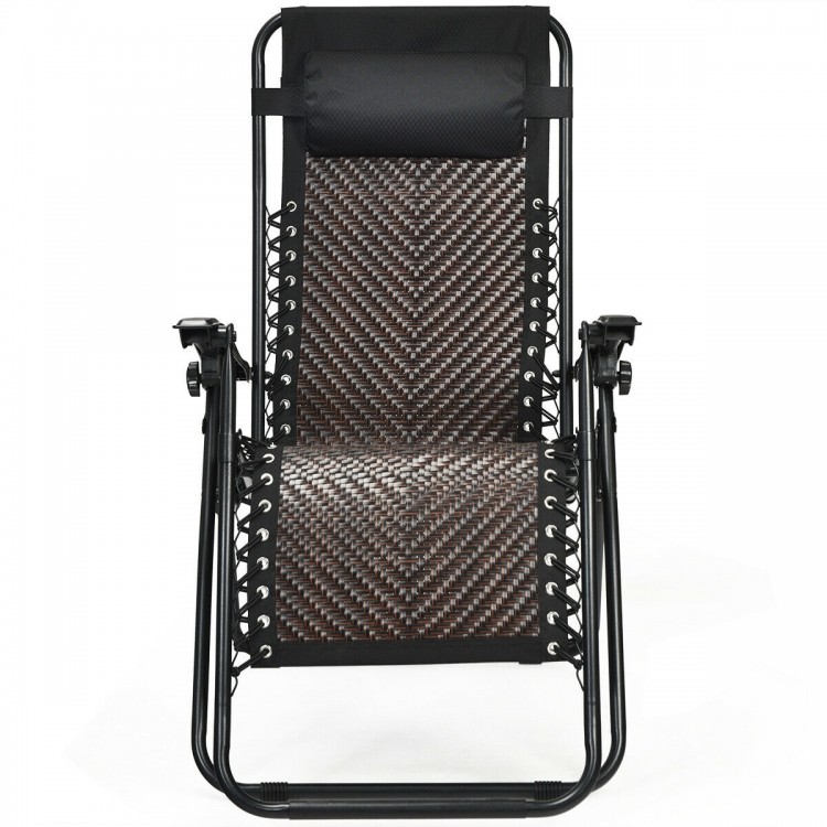 Folding patio rattan zero gravity lounge chair with ergonomic armrest and removable head pillow for outdoor comfort.