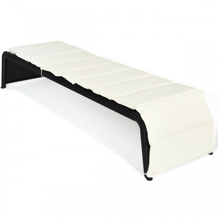Adjustable patio rattan lounge chair with white cushion, sturdy steel frame, ideal for outdoor relaxation by the pool.