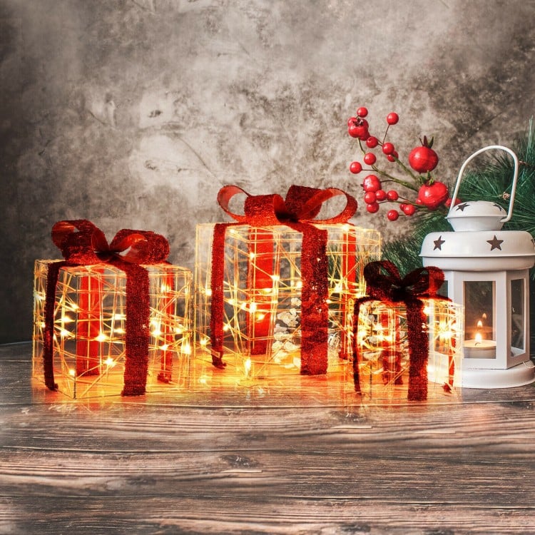 Three lighted Christmas gift boxes with red ribbons, featuring 60 LED lights for festive indoor and outdoor decoration.
