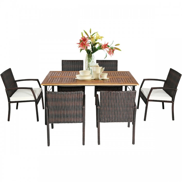 Cushioned armchair from the patio dining set, crafted with weather-resistant PE rattan for comfortable outdoor seating.