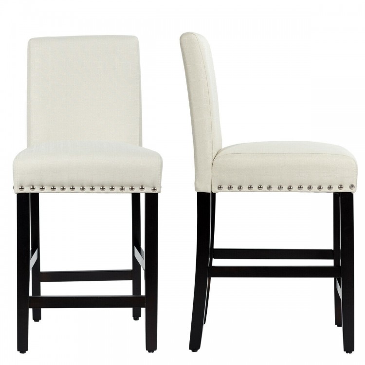 Beige kitchen chairs with rubber wood legs, featuring a soft cushion and curved backrest for comfort and support.