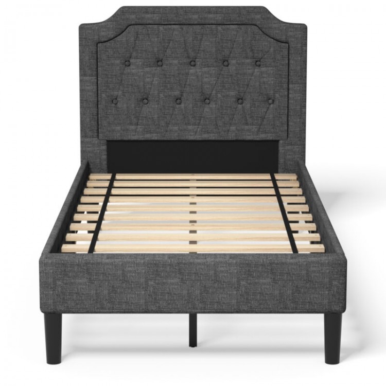 Twin upholstered platform bed with button-tufted headboard and wooden slats, ideal for stylish and functional bedroom.